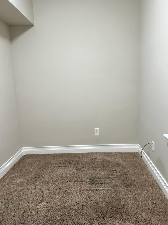 2122 N Lorel Ave, Chicago, IL 60639 - spare room featuring dark colored carpet and baseboards