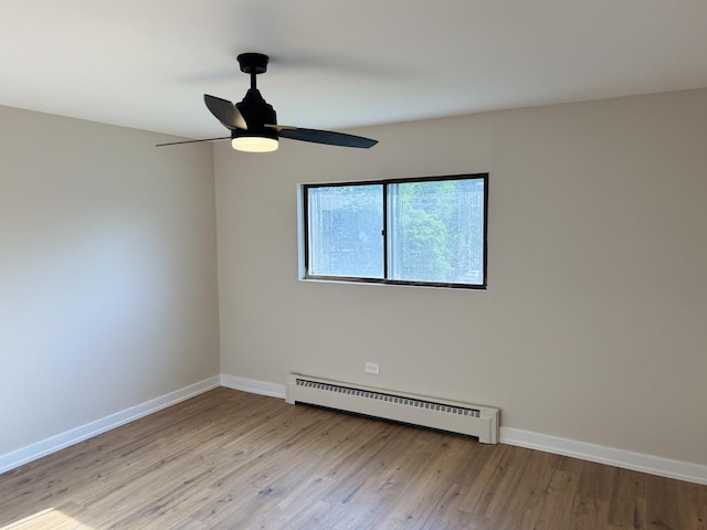 18550 Torrence Ave Unit 25, Lansing, IL 60438 - unfurnished room with baseboard heating, light wood-style flooring, and ceiling fan