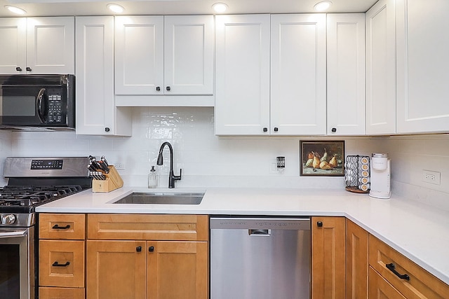 110 W Butterfield Rd Unit 503S, Elmhurst, IL 60126 - kitchen with appliances with stainless steel finishes, light countertops, backsplash, and white cabinetry