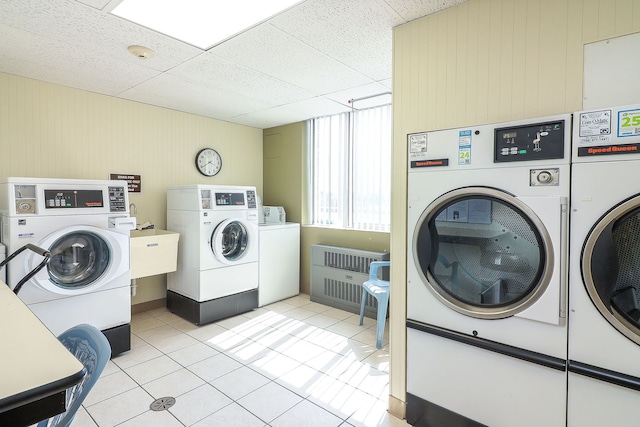 110 W Butterfield Rd Unit 503S, Elmhurst, IL 60126 - community laundry room featuring washer and clothes dryer, light tile patterned floors, and wood walls