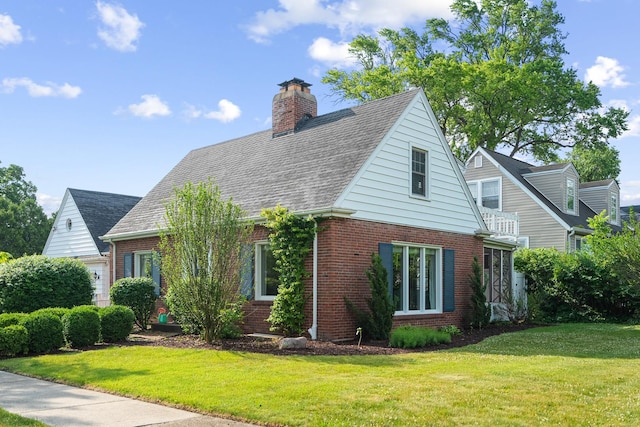 1155 E Walnut Ave, Des Plaines, IL 60016 - view of front of home with brick siding, a front lawn, and a chimney