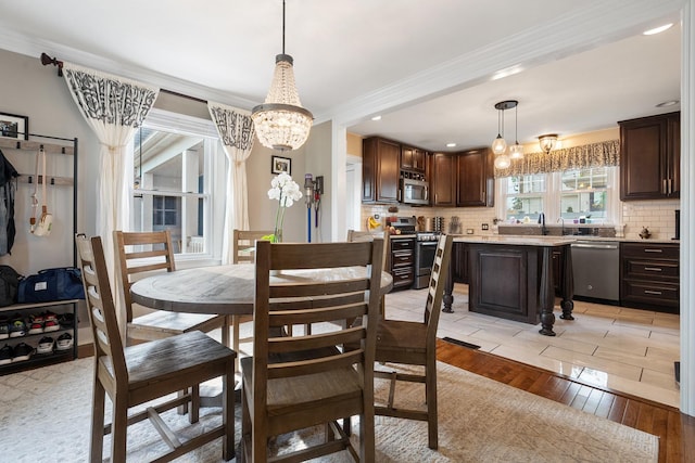 1155 E Walnut Ave, Des Plaines, IL 60016 - dining room featuring a chandelier, ornamental molding, light wood finished floors, and recessed lighting