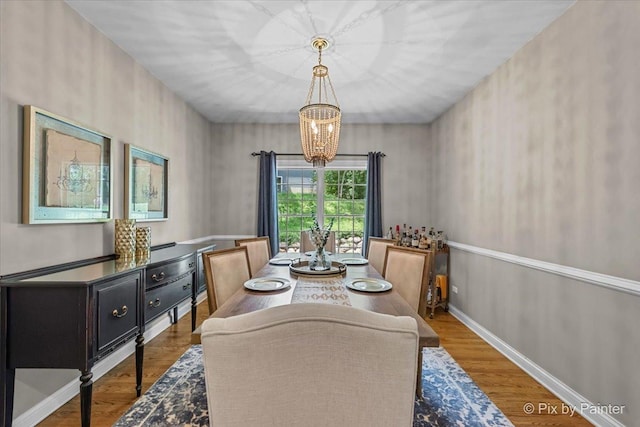6407 Kingsbridge Dr, Cary, IL 60013 - dining room featuring a chandelier and wood finished floors