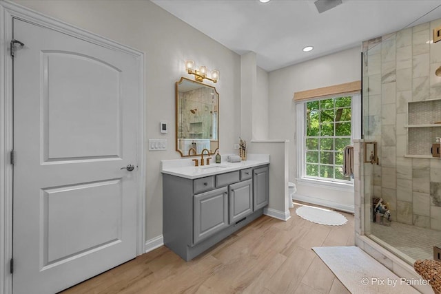 6407 Kingsbridge Dr, Cary, IL 60013 - full bathroom with a stall shower, vanity, recessed lighting, and wood finished floors