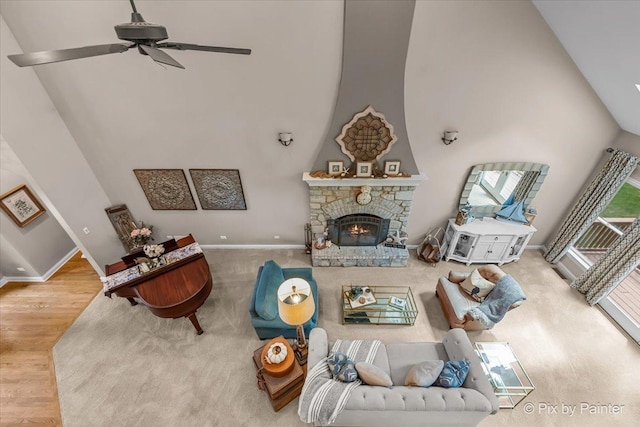6407 Kingsbridge Dr, Cary, IL 60013 - living room with high vaulted ceiling, wood finished floors, a fireplace, and a ceiling fan
