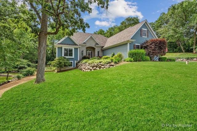 6407 Kingsbridge Dr, Cary, IL 60013 - view of front facade with a front lawn and roof with shingles