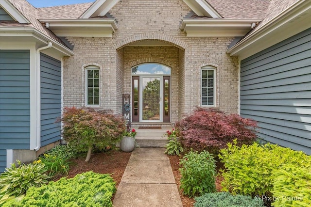6407 Kingsbridge Dr, Cary, IL 60013 - doorway to property featuring brick siding and roof with shingles