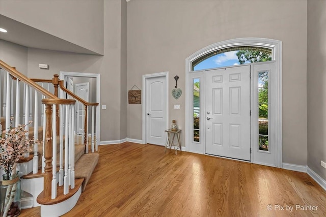 6407 Kingsbridge Dr, Cary, IL 60013 - entryway featuring wood finished floors, stairway, and a high ceiling