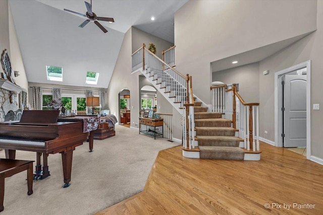 6407 Kingsbridge Dr, Cary, IL 60013 - carpeted entrance foyer featuring high vaulted ceiling, stairway, ceiling fan, arched walkways, and recessed lighting