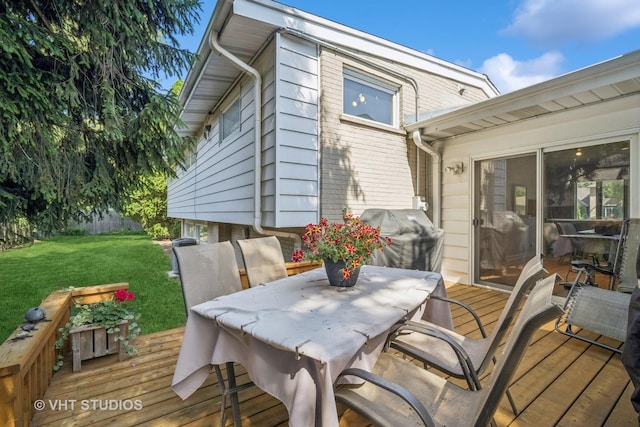 1037 Arbor Ln, Glenview, IL 60025 - deck with area for grilling, a lawn, and outdoor dining area