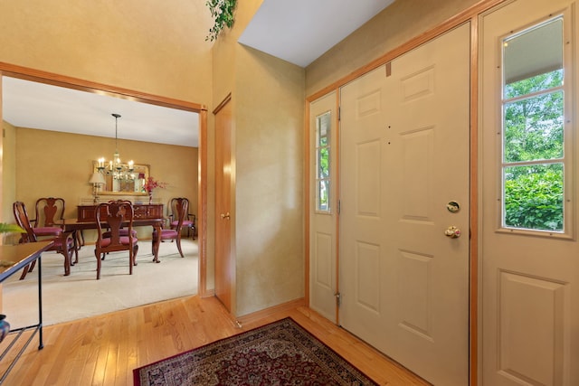 12 White Oak Ct, Algonquin, IL 60102 - foyer featuring light wood-style flooring and a chandelier