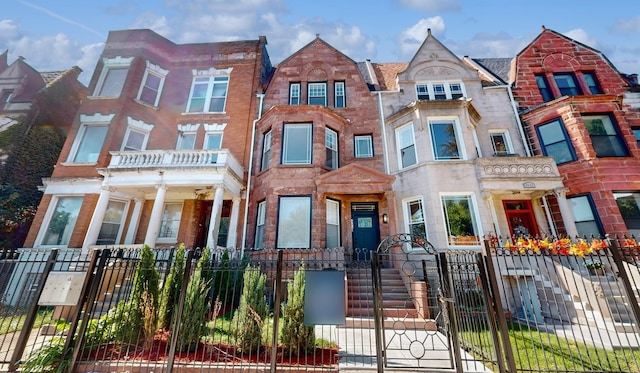 4450 S Prairie Ave, Chicago, IL 60653 - view of property featuring a fenced front yard and a gate