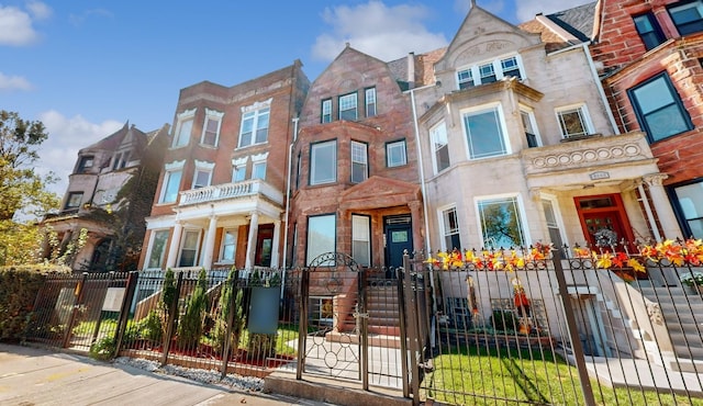 4450 S Prairie Ave, Chicago, IL 60653 - view of property featuring a fenced front yard and a gate