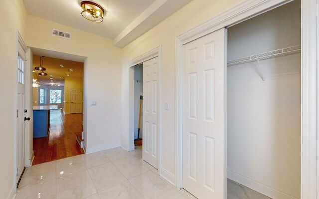 4450 S Prairie Ave, Chicago, IL 60653 - corridor with baseboards and light tile patterned floors