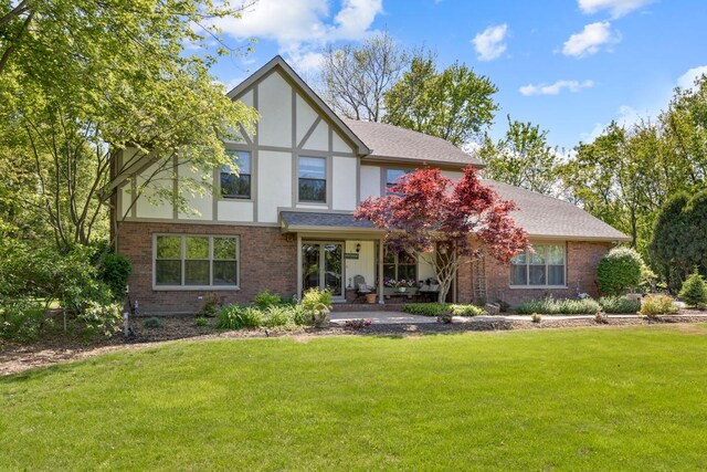 21326 N Elder Ct, Kildeer, IL 60047 - view of front of house with a front lawn, brick siding, and stucco siding