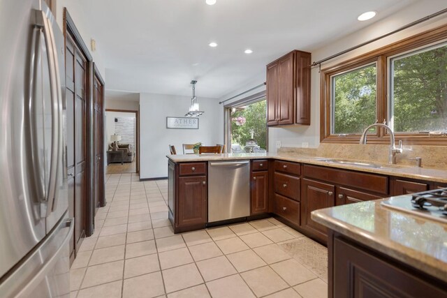 21326 N Elder Ct, Kildeer, IL 60047 - kitchen with stainless steel appliances, recessed lighting, a peninsula, light tile patterned flooring, and hanging light fixtures