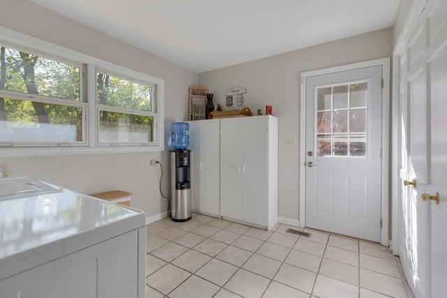 21326 N Elder Ct, Kildeer, IL 60047 - laundry room featuring cabinet space, light tile patterned floors, and washer and clothes dryer