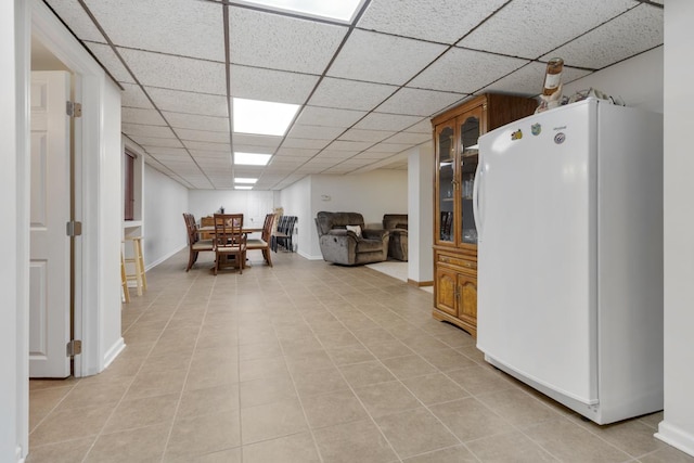 21326 N Elder Ct, Kildeer, IL 60047 - kitchen with freestanding refrigerator, glass insert cabinets, a paneled ceiling, and light tile patterned floors