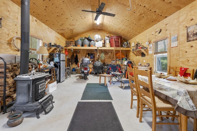 21326 N Elder Ct, Kildeer, IL 60047 - interior space featuring vaulted ceiling, a wood stove, ceiling fan, and concrete floors
