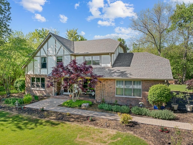 21326 N Elder Ct, Kildeer, IL 60047 - english style home with roof with shingles, a front lawn, and brick siding