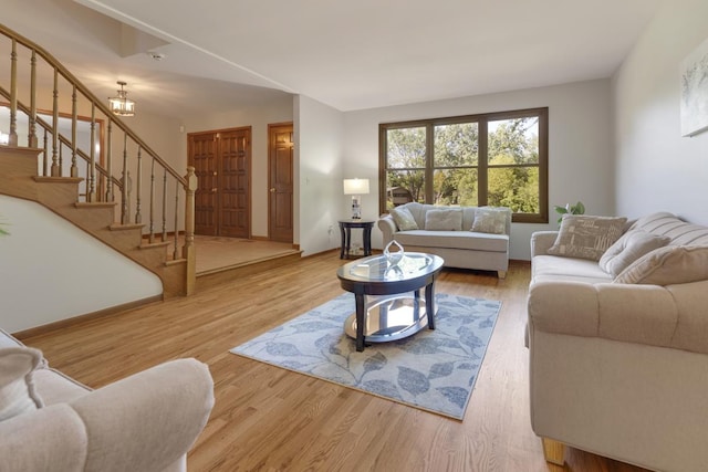 21326 N Elder Ct, Kildeer, IL 60047 - living room featuring stairway, wood finished floors, and a chandelier