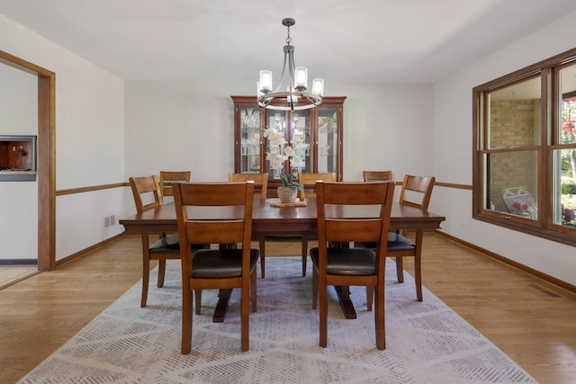 21326 N Elder Ct, Kildeer, IL 60047 - dining room with a chandelier and light wood-type flooring