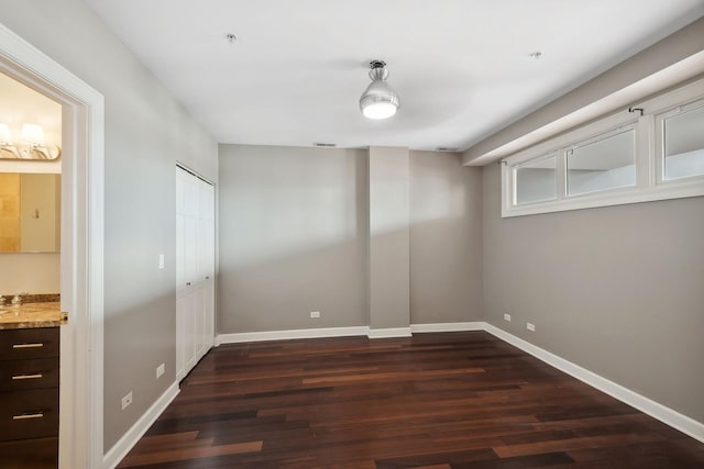 70 E 18th St Unit 4E, Chicago, IL 60616 - unfurnished bedroom featuring dark wood finished floors and connected bathroom