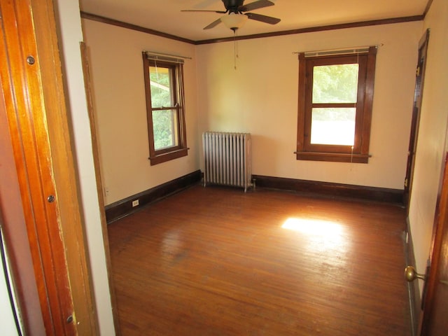1101 N Hart St, Harvard, IL 60033 - unfurnished room featuring radiator, wood finished floors, ornamental molding, and a ceiling fan
