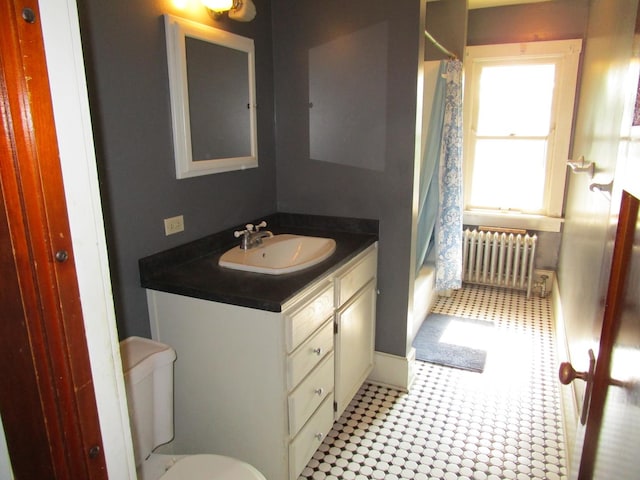 1101 N Hart St, Harvard, IL 60033 - full bathroom featuring radiator heating unit, vanity, and shower / bath combo