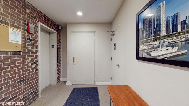6333 N Milwaukee Ave Unit 2E, Chicago, IL 60646 - doorway featuring brick wall, elevator, and a view of skyline