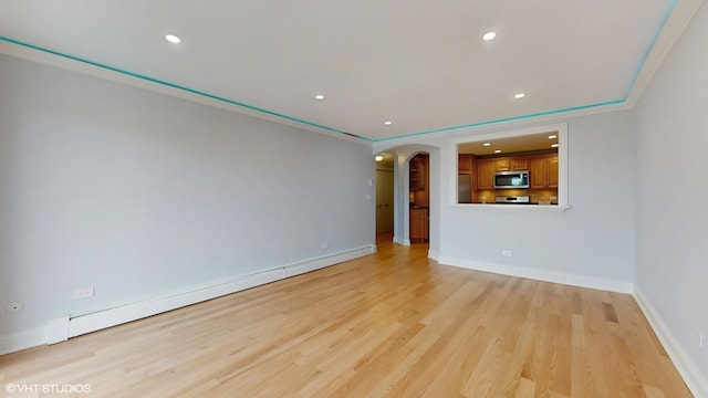 6333 N Milwaukee Ave Unit 2E, Chicago, IL 60646 - unfurnished room featuring arched walkways, light wood-style floors, recessed lighting, a baseboard radiator, and crown molding