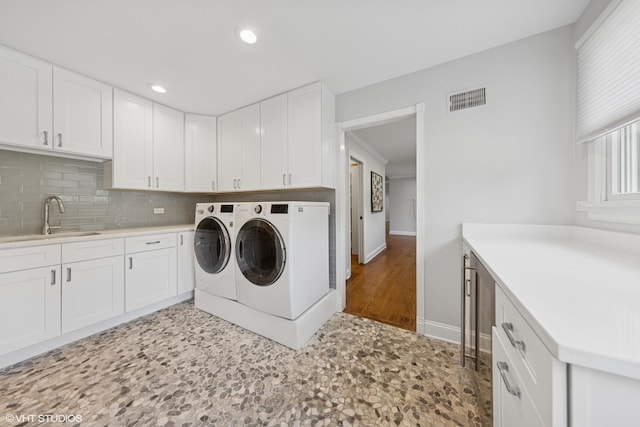 301 E 59th St, Hinsdale, IL 60521 - laundry room featuring washer and clothes dryer, cabinet space, and recessed lighting