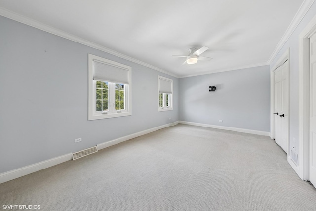 301 E 59th St, Hinsdale, IL 60521 - spare room with ornamental molding, ceiling fan, and light carpet