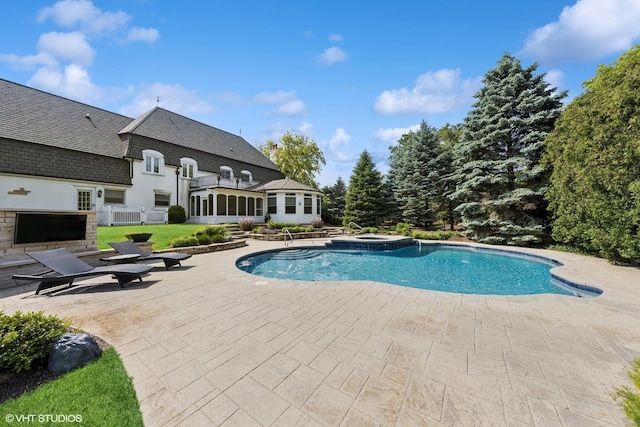 301 E 59th St, Hinsdale, IL 60521 - view of swimming pool with a sunroom, a patio area, a yard, and a pool with connected hot tub