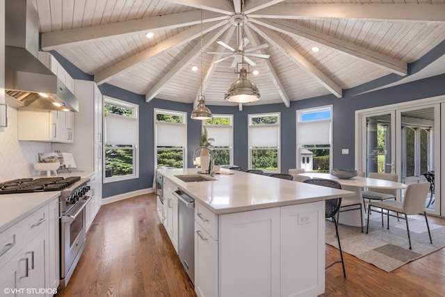 301 E 59th St, Hinsdale, IL 60521 - kitchen featuring appliances with stainless steel finishes, wall chimney range hood, wood ceiling, a kitchen bar, and white cabinetry