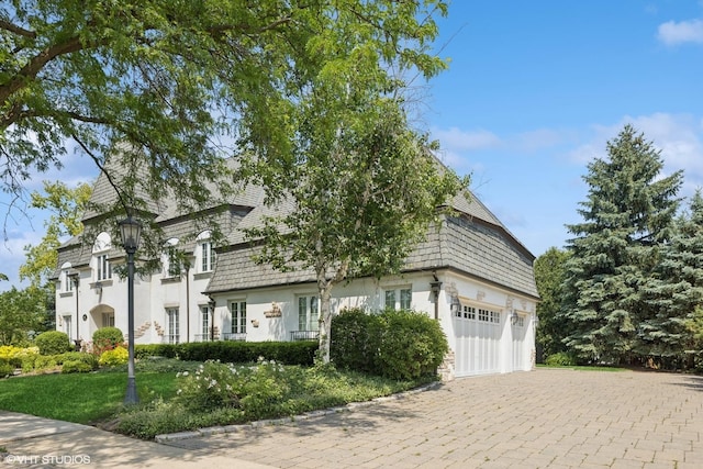 301 E 59th St, Hinsdale, IL 60521 - view of front of property featuring decorative driveway, a garage, and mansard roof