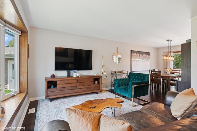0N101 Pleasant Hill Rd, Wheaton, IL 60187 - living area featuring wood finished floors and a chandelier