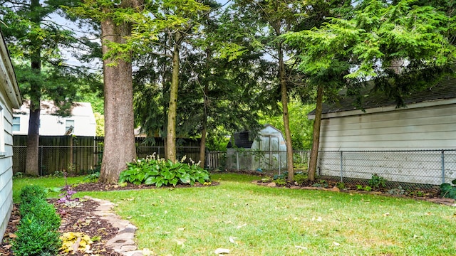 805 S Anderson St, Urbana, IL 61801 - fenced backyard featuring a storage unit