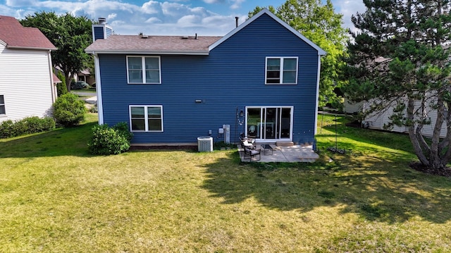 2440 Pebblewood Ct, Aurora, IL 60506 - rear view of property with a chimney, a patio, and a yard