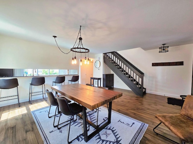 2440 Pebblewood Ct, Aurora, IL 60506 - dining space featuring stairway, wood finished floors, and a chandelier
