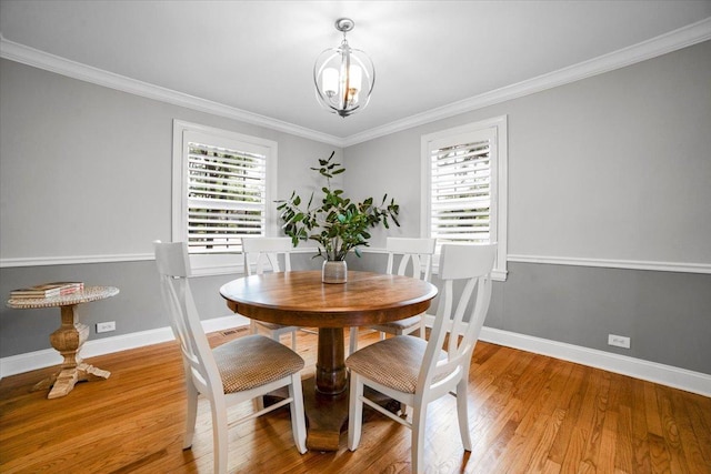 3976 Western Ave, Western Springs, IL 60558 - dining space with plenty of natural light, light wood finished floors, a chandelier, and ornamental molding