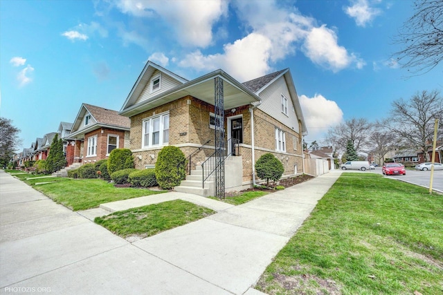 6100 W Byron St, Chicago, IL 60634 - view of front of property with brick siding, a front yard, and a residential view