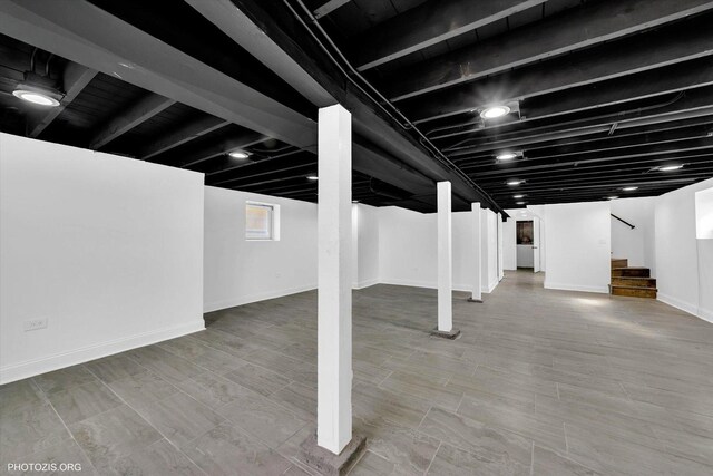 6100 W Byron St, Chicago, IL 60634 - basement featuring stairs and baseboards