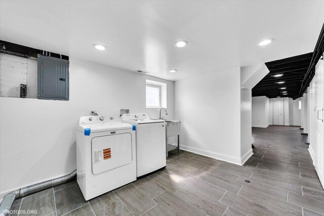 6100 W Byron St, Chicago, IL 60634 - laundry area featuring electric panel, separate washer and dryer, recessed lighting, and wood tiled floors