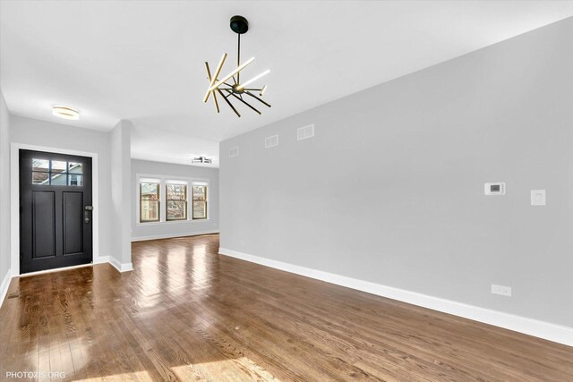 6100 W Byron St, Chicago, IL 60634 - entrance foyer featuring a chandelier and wood finished floors