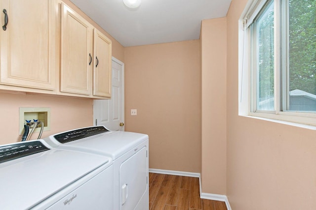 1531 Cumberland Pkwy, Algonquin, IL 60102 - washroom with cabinet space, healthy amount of natural light, wood finished floors, and separate washer and dryer