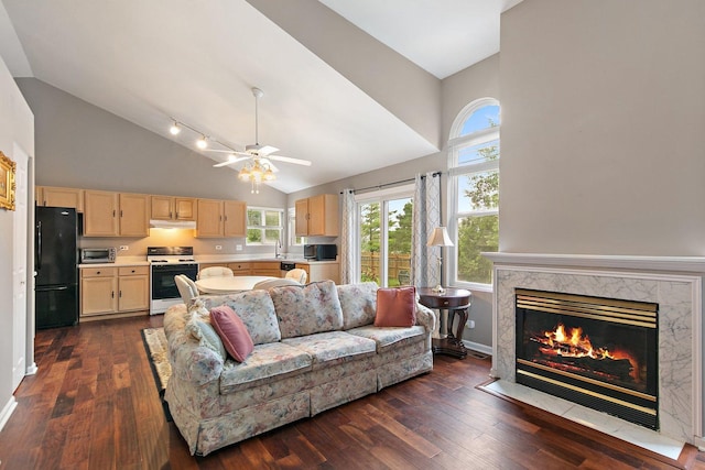 1531 Cumberland Pkwy, Algonquin, IL 60102 - living room with high vaulted ceiling, dark wood-style flooring, plenty of natural light, a high end fireplace, and a ceiling fan