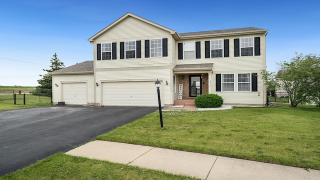 1420 Kennedy Dr, Kirkland, IL 60146 - view of front facade featuring driveway, a garage, and roof with shingles