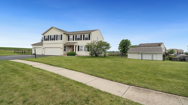 1420 Kennedy Dr, Kirkland, IL 60146 - view of front facade featuring asphalt driveway and an attached garage