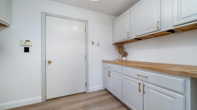 1420 Kennedy Dr, Kirkland, IL 60146 - washroom featuring light wood-type flooring and baseboards